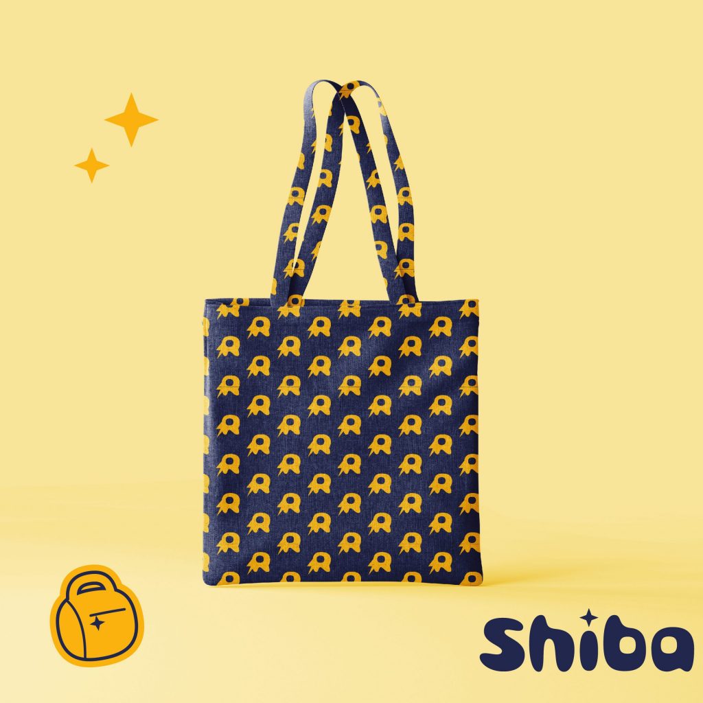 Design für Einkaufstasche bestehend aus dem Brand-Muster von Shiba Rebel: "R" mit Blitz in gelb auf dunkelblauer Fläche| Kremer Signature Design